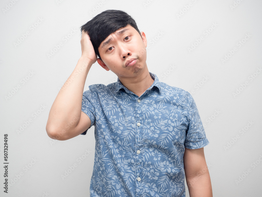 Man blue shirt feel confused gesture scratch his head isolated Man blue shirt feel confused gesture scratch his head isolated