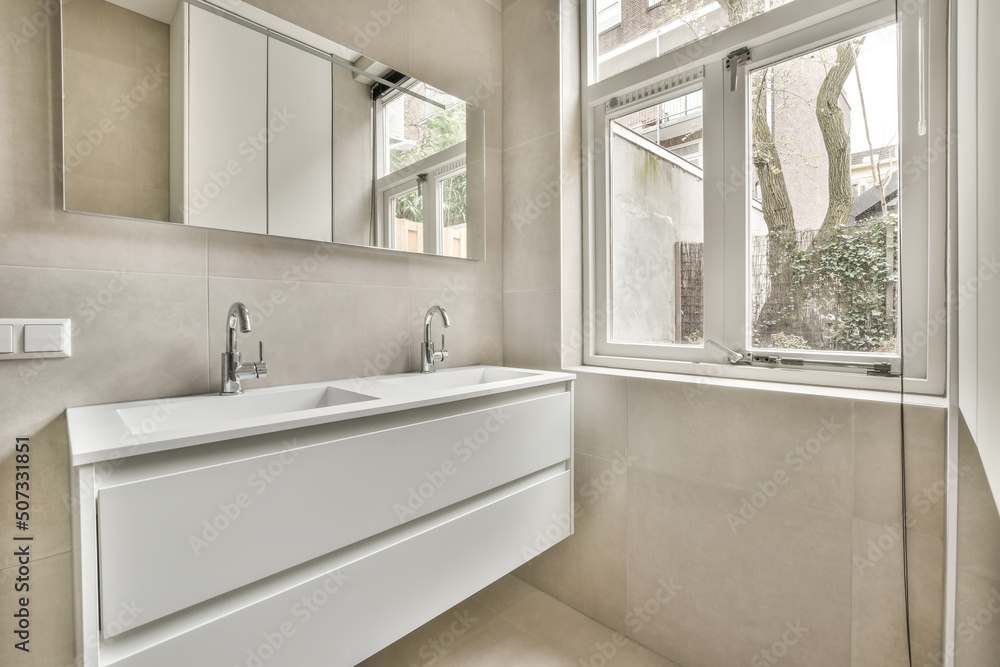 Modern bathroom with double sink drawer and mirror on wall Modern bathroom with double sink drawer and mirror on wall