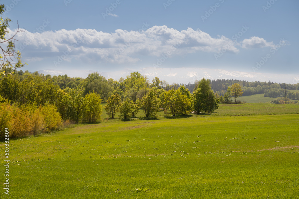 Karkonoskie Foothills in Poland called Krkonošské podhůří or Pogórze Karkonoskie with a view of Szrenica and Snieżne Kotły in earli spring Karkonoskie Foothills in Poland called Krkonošské podhůří or Pogórze Karkonoskie with a view of Szrenica and Snieżne Kotły in earli spring
