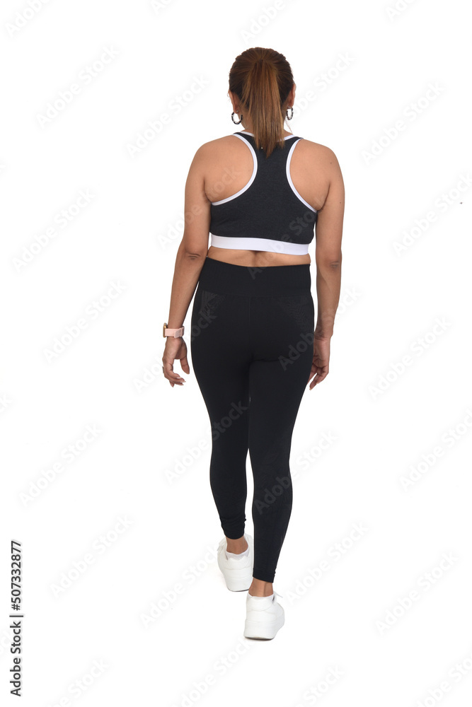 back view of a woman sportswear walking on white background back view of a woman sportswear walking on white background