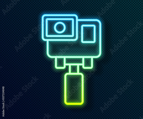 Glowing neon line Action extreme camera icon isolated on black background. Video camera equipment for filming extreme sports. Vector
