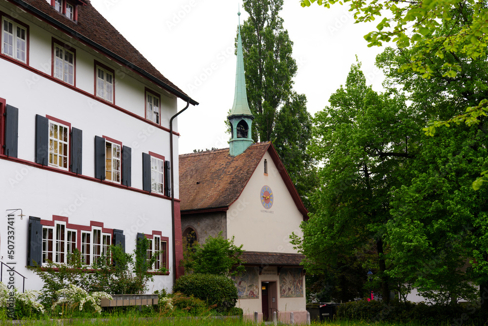 Historic house with chapel at district of St. Jakob at City of Basel on a cloudy spring day. Photo taken April 27th, 2022, Basel, Switzerland.