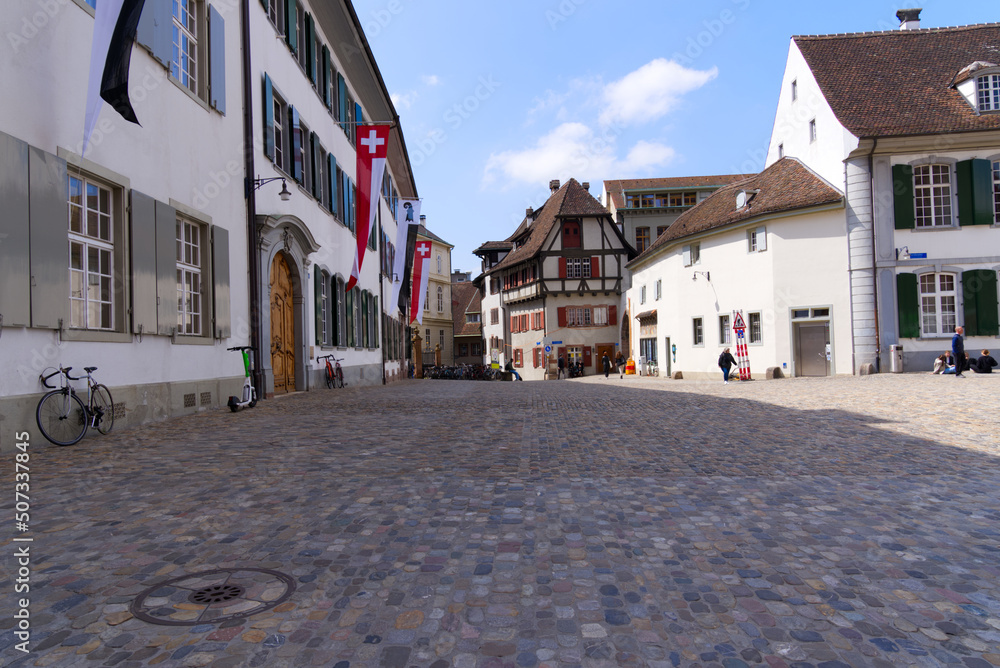 Minster Square with historic houses at the old town of City of Basel on a blue cloudy spring day. Photo taken April 27th, 2022, Basel, Switzerland. 