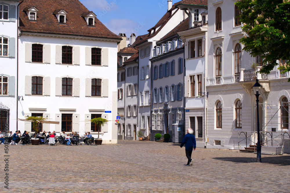 Minster Square with historic houses at the old town of City of Basel on a blue cloudy spring day. Photo taken April 27th, 2022, Basel, Switzerland.