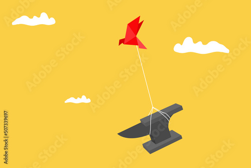 origami paper bird lifting heavy iron anvil. Concept of difficult business.