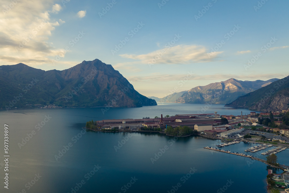 Aerial view of Lake Iseo at sunrise, on the right the city of lovere which runs along the lake,Bergamo Italy.
