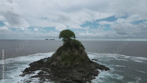 Danta Beach in Guanacaste, Las Catalinas town, Costa Rica. aerial drone shot tropical beach. Islet with tree photo