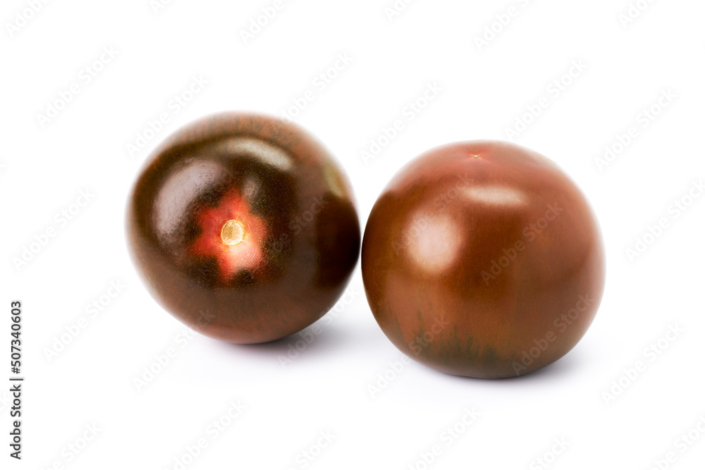 Two red cherry tomatoes on a white background Two red cherry tomatoes on a white background