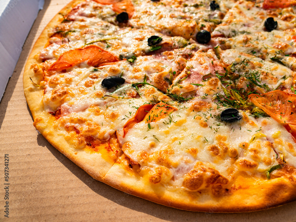 Pizza in a cardboard box. View from above. Pizza menu.Pizza delivery, fast food concept.
