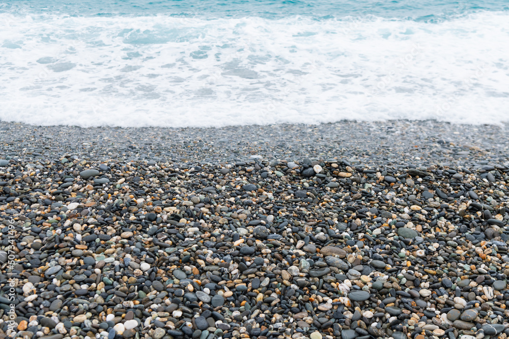 Waves crashing on the pebbled coast, the seaside of Qixingtan in Hualien, Taiwan Waves crashing on the pebbled coast, the seaside of Qixingtan in Hualien, Taiwan
