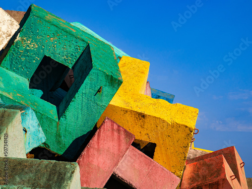 View of bright multicolored breakwaters on a blue background. Copy space.
 photo