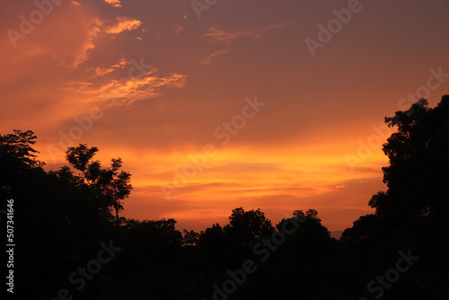 Red sunset view from village area.