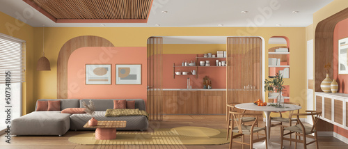 Panoramic view of modern wooden kitchen, dining and living room in orange tones, sofa with carpet, table with chairs, sliding door. Window, parquet and cane ceiling. Interior design