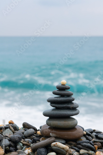 stacked stones  tower or pyramid of stones on the beach  balance  Sea waves background    Hualien  Taiwan   