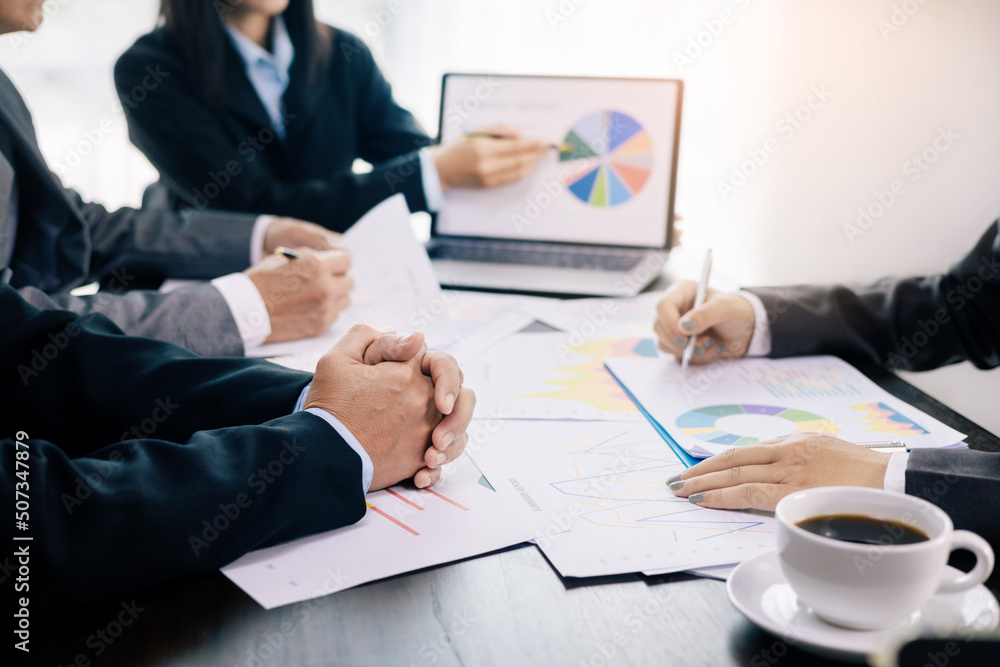 business team Analysis graph to discuss company financial statistics, brainstorm ideas, Teamwork Business Meeting Concept. business team Analysis graph to discuss company financial statistics, brainstorm ideas, Teamwork Business Meeting Concept.