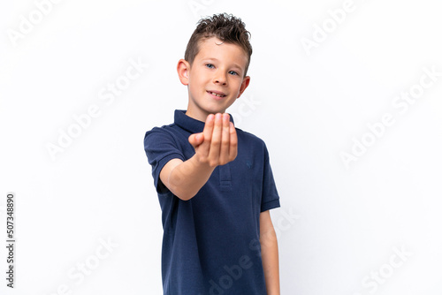 Little caucasian boy isolated on white background inviting to come with hand. Happy that you came
