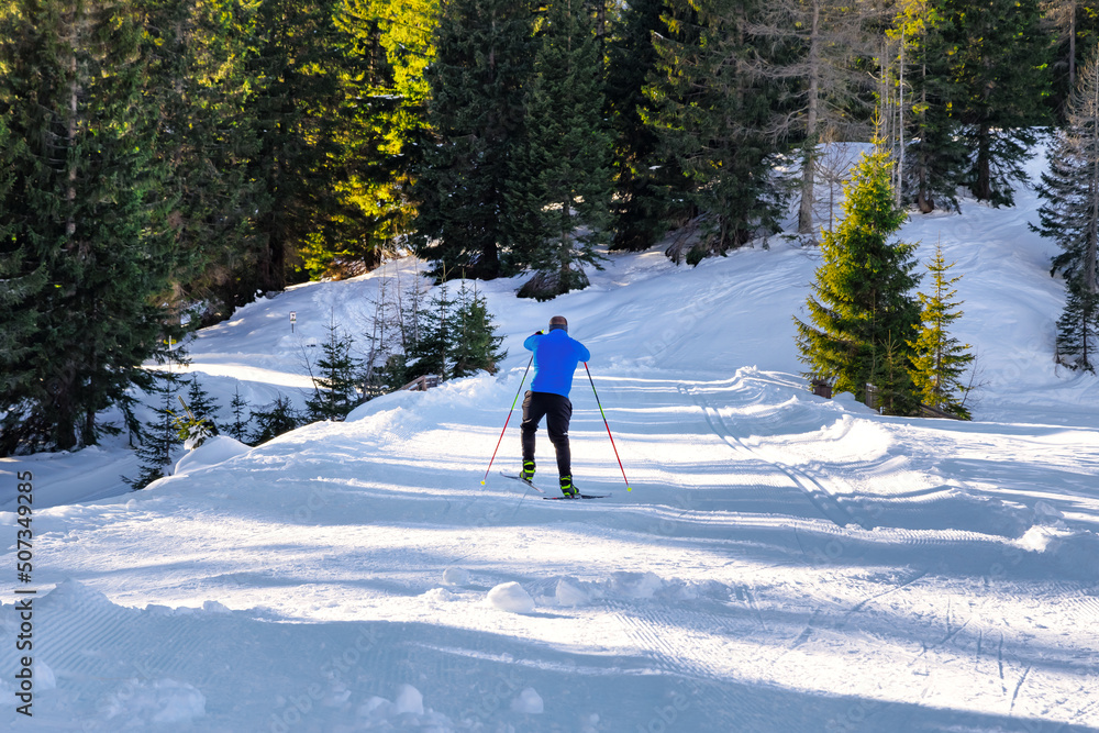Cross-country skiing. Man doing outdoor sports. Winter sports and healthy lifestyle.