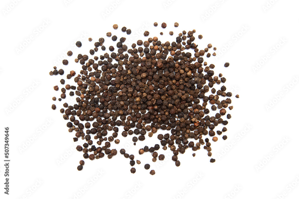 Black pepper on a white background. Black pepper on a white background.