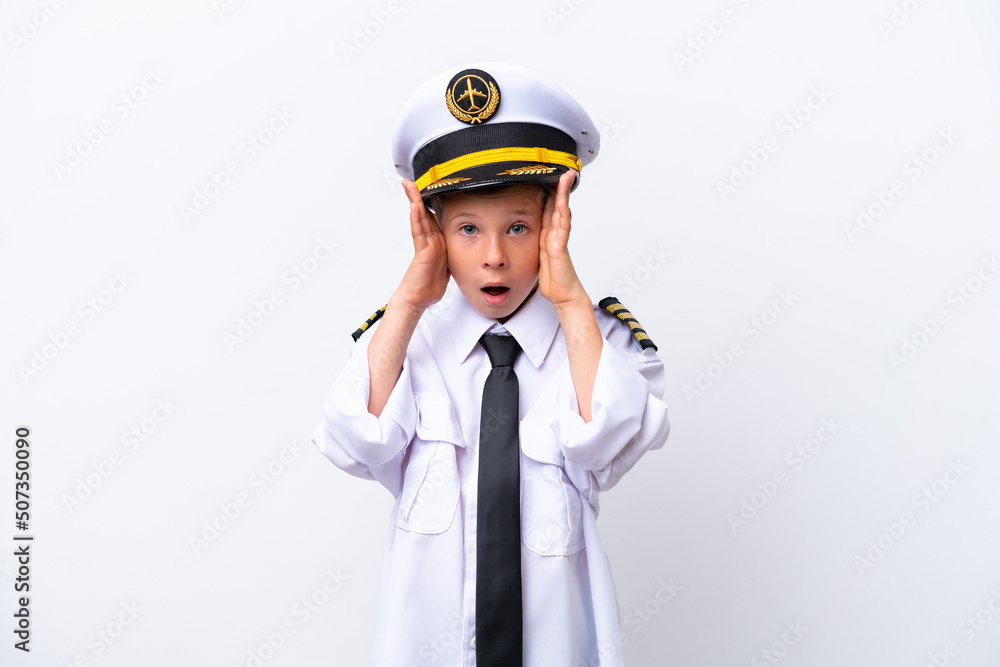 Little airplane pilot boy isolated on white background with surprise expression Little airplane pilot boy isolated on white background with surprise expression