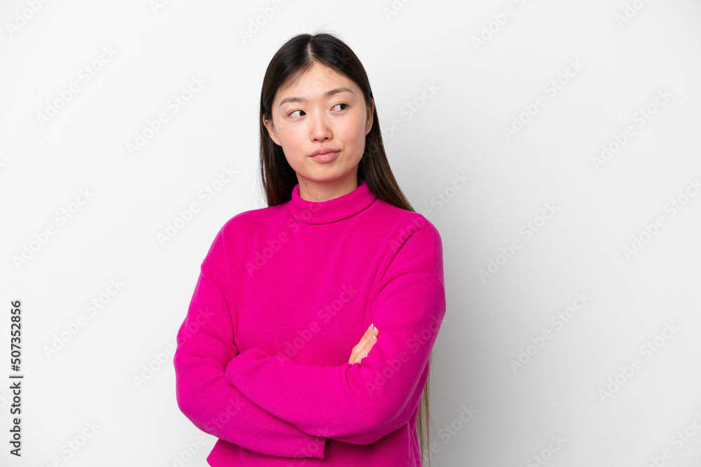 Young Chinese woman isolated on white background keeping the arms crossed Young Chinese woman isolated on white background keeping the arms crossed