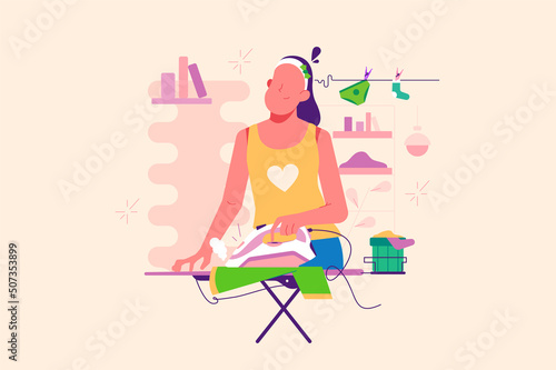 Young woman ironing washed things, housework and housekeeping