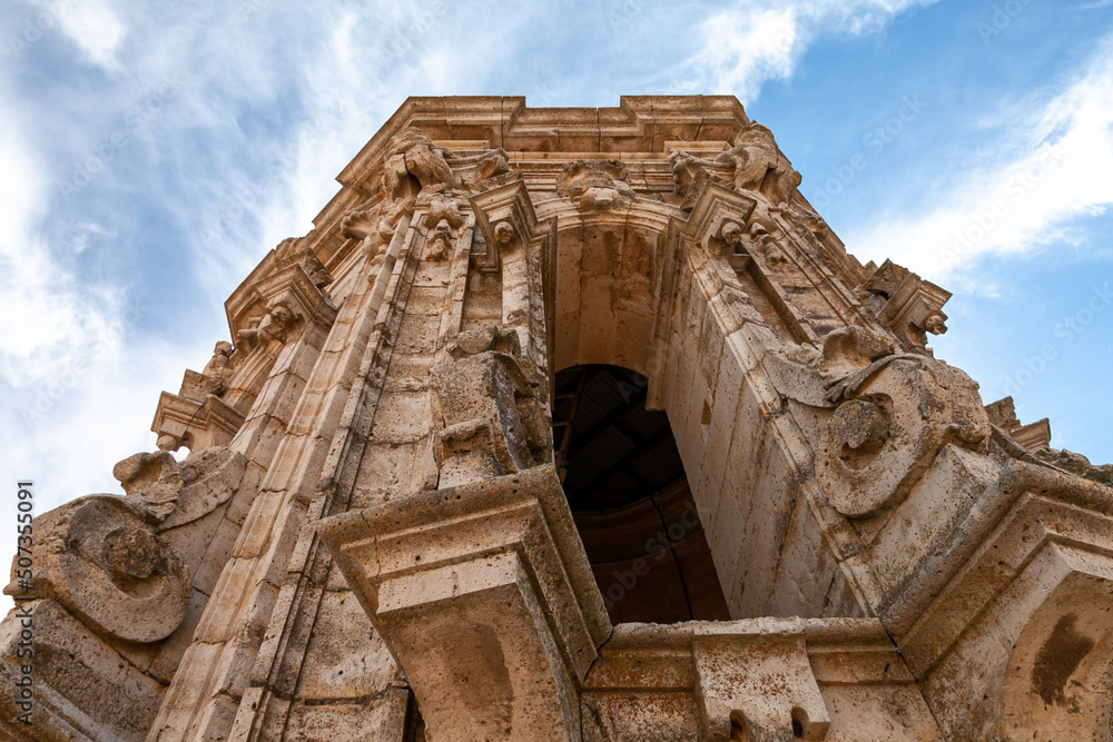 detail of a granite bell tower of a medieval Spanish church