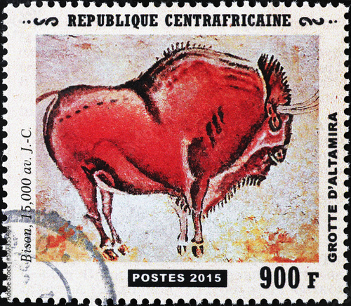 Bison from prehistoric depictions of Altamira on postage stamp photo