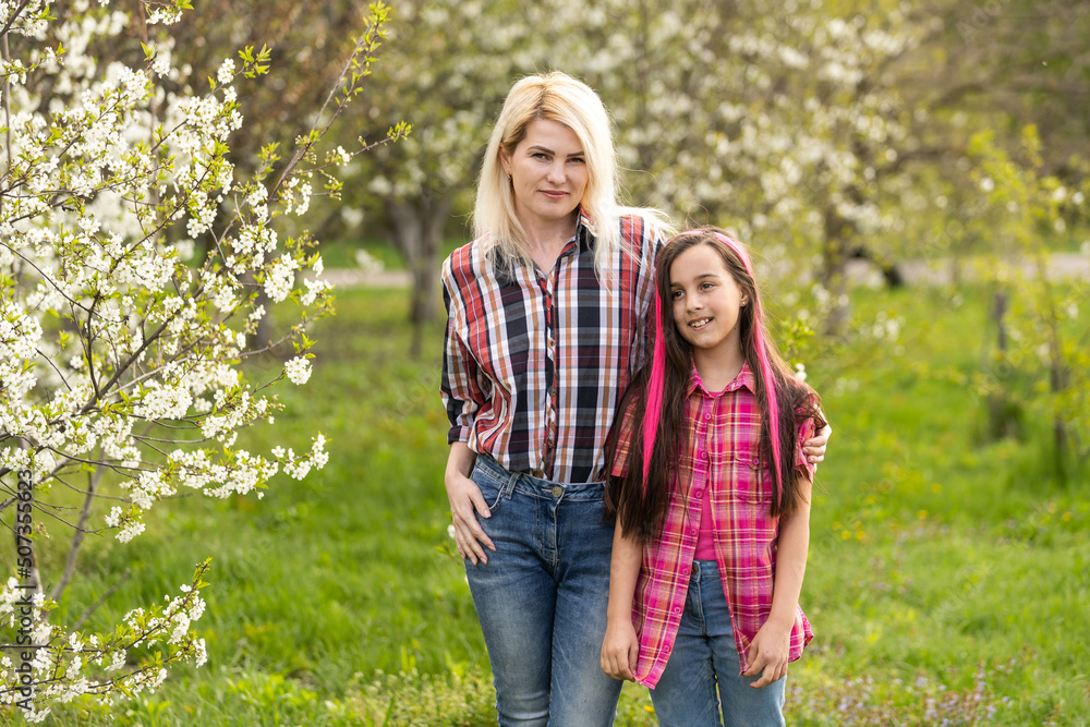 Fototapeta premium Portrait of cheerful mother and daughter