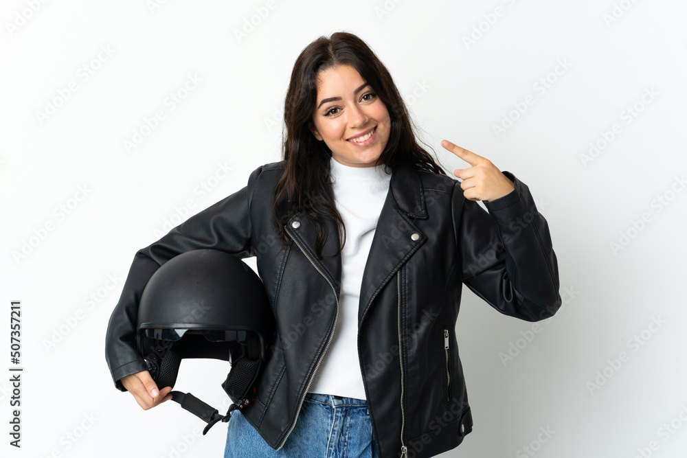 Woman holding a motorcycle helmet isolated on white background giving a thumbs up gesture Woman holding a motorcycle helmet isolated on white background giving a thumbs up gesture