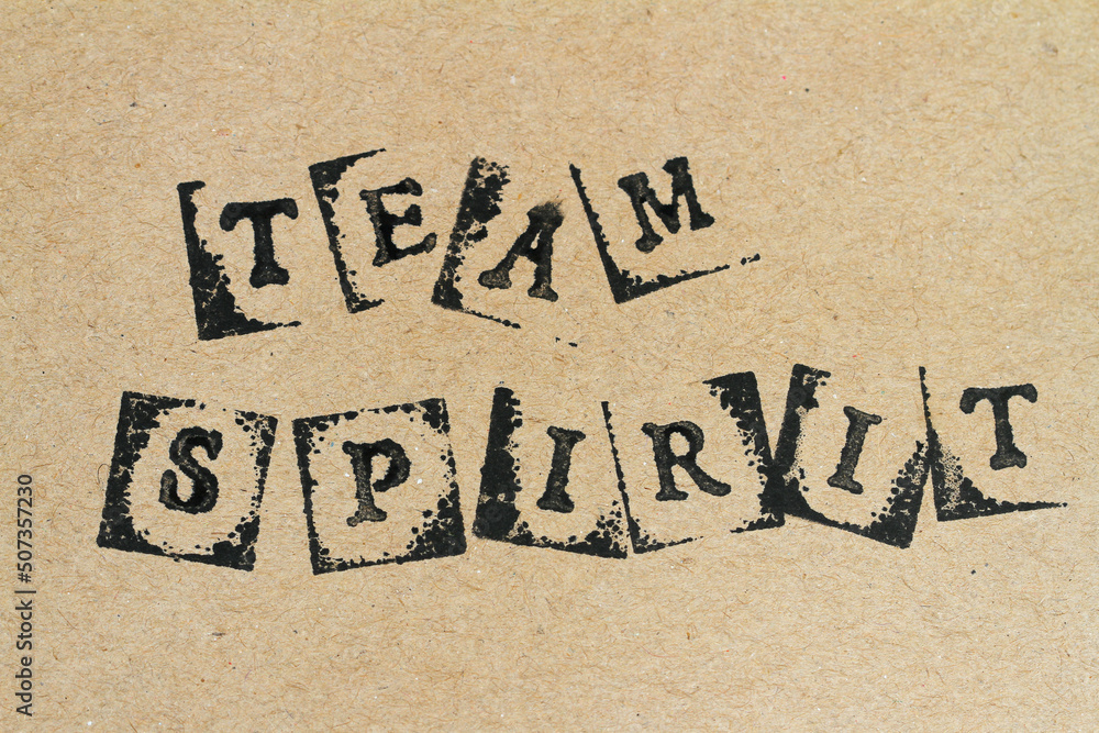 Text team spirit made with stamps on handmade brown paper