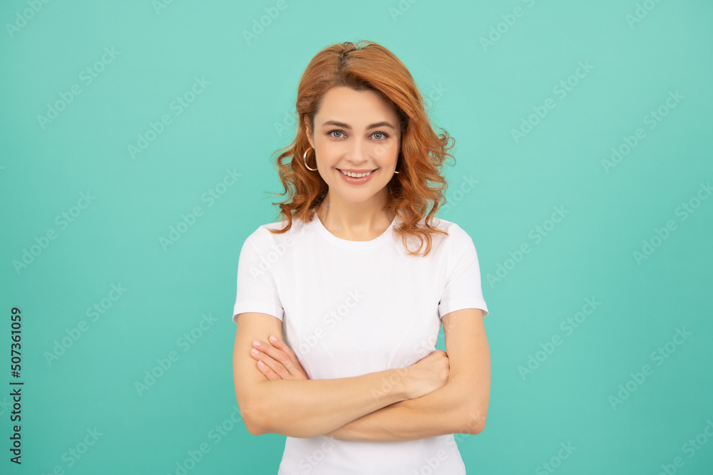 cheerful redhead girl with curly hair on blue background cheerful redhead girl with curly hair on blue background