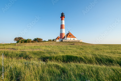 Westerheversand Lighthouse and Salzwiesen (salt marsh) in summer, Westerhever, Nordfriesland, Schleswig-Holstein, Germany photo