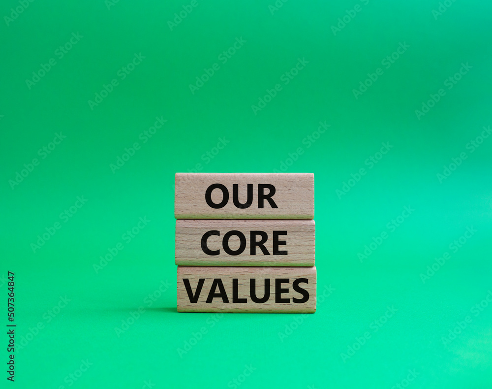 Our core values symbol. Concept words 'Our core values' on wooden blocks. Beautiful green background. Business and Our core values concept. Copy space. Our core values symbol. Concept words 'Our core values' on wooden blocks. Beautiful green background. Business and Our core values concept. Copy space.