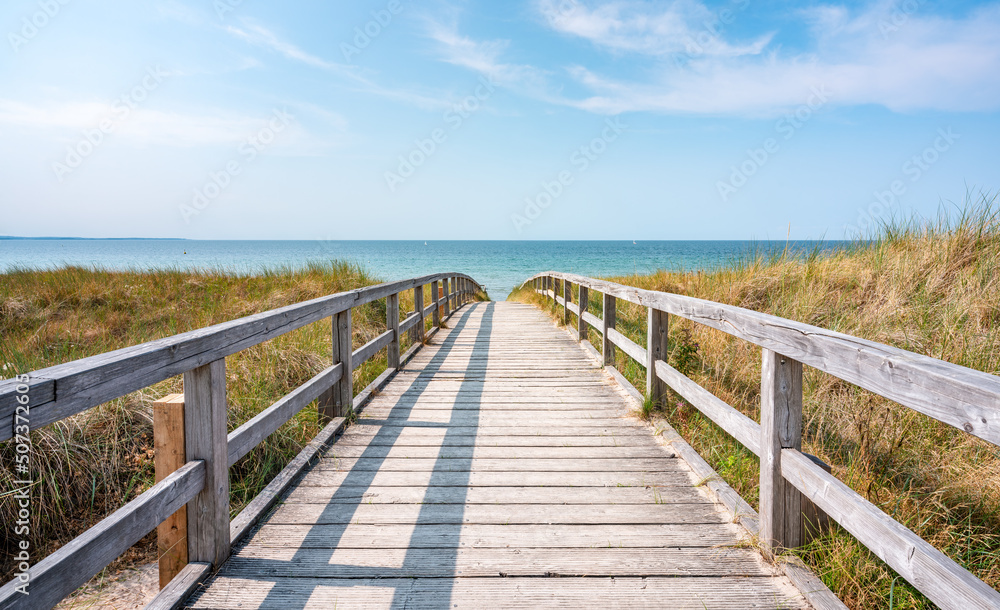 Wooden walkway at the beach in summer