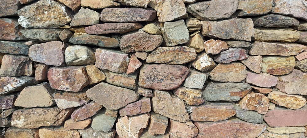 Fototapeta premium Natursteinmauer, Mauer mit Natursteinen, steinwand, stone wall
