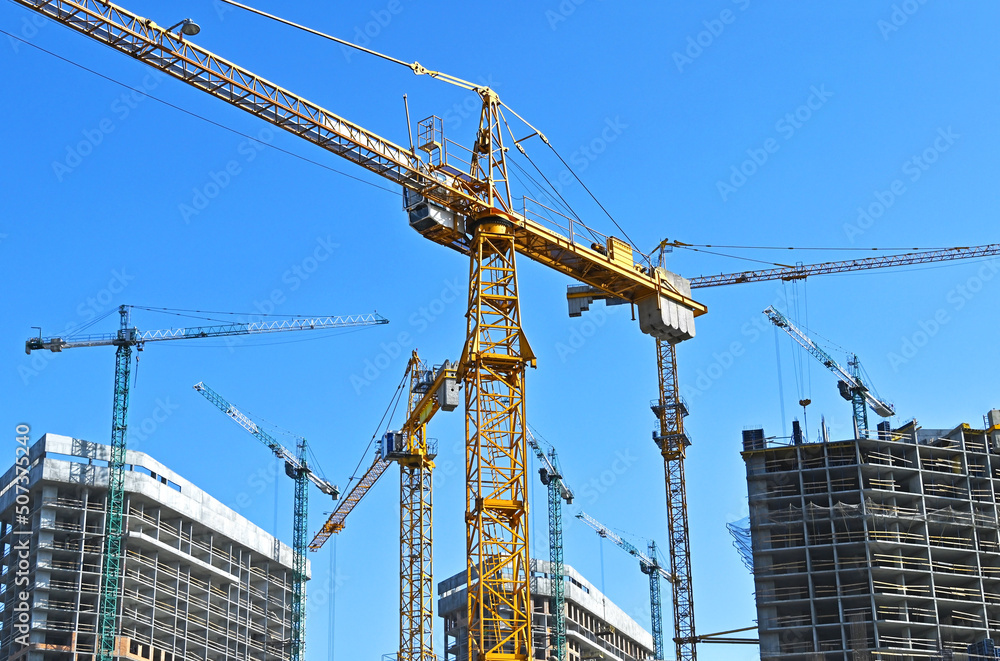 Crane and highrise construction site Crane and highrise construction site