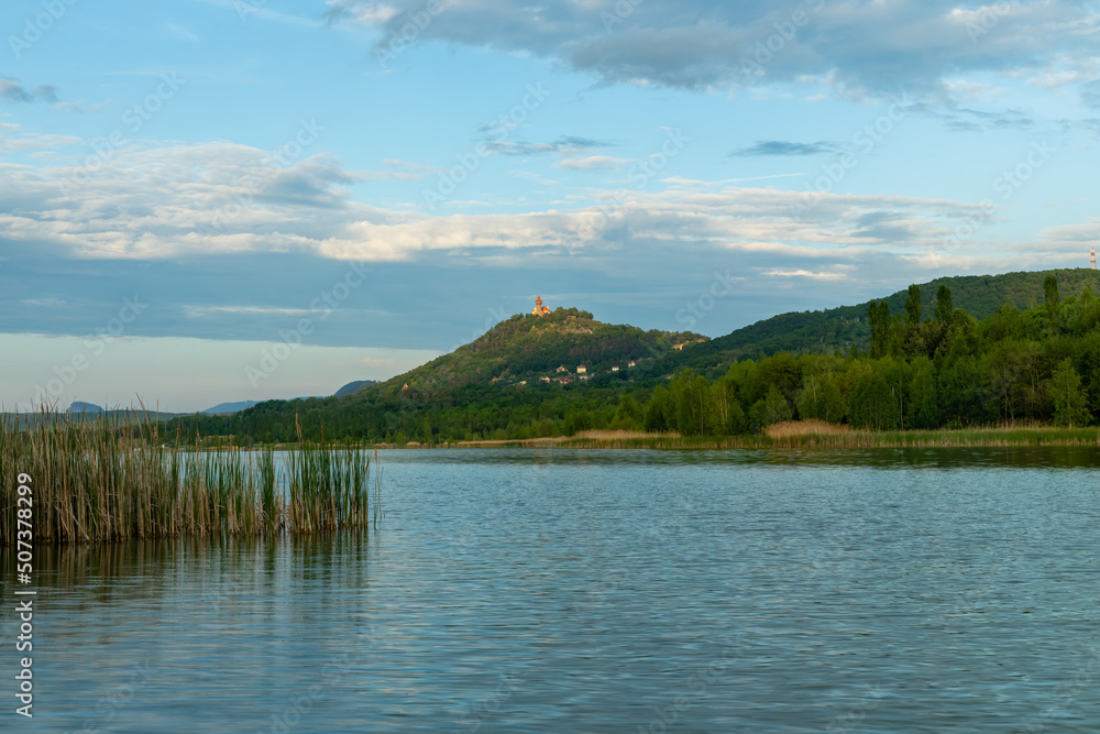 Castle on the top of the hill over the lake