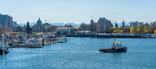 Victoria Inner Harbour. Historical buildings in the background over blue sky. Panoramic view. photo