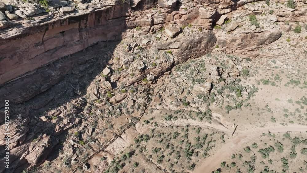 Aerial rocky cliff mountain south Utah descend. Montezuma Canyon southern Utah. Ancient native American, Indian dwelling, kiva, house, cliff dwelling, granary, rock art, hieroglyphs. Aerial rocky cliff mountain south Utah descend. Montezuma Canyon southern Utah. Ancient native American, Indian dwelling, kiva, house, cliff dwelling, granary, rock art, hieroglyphs.