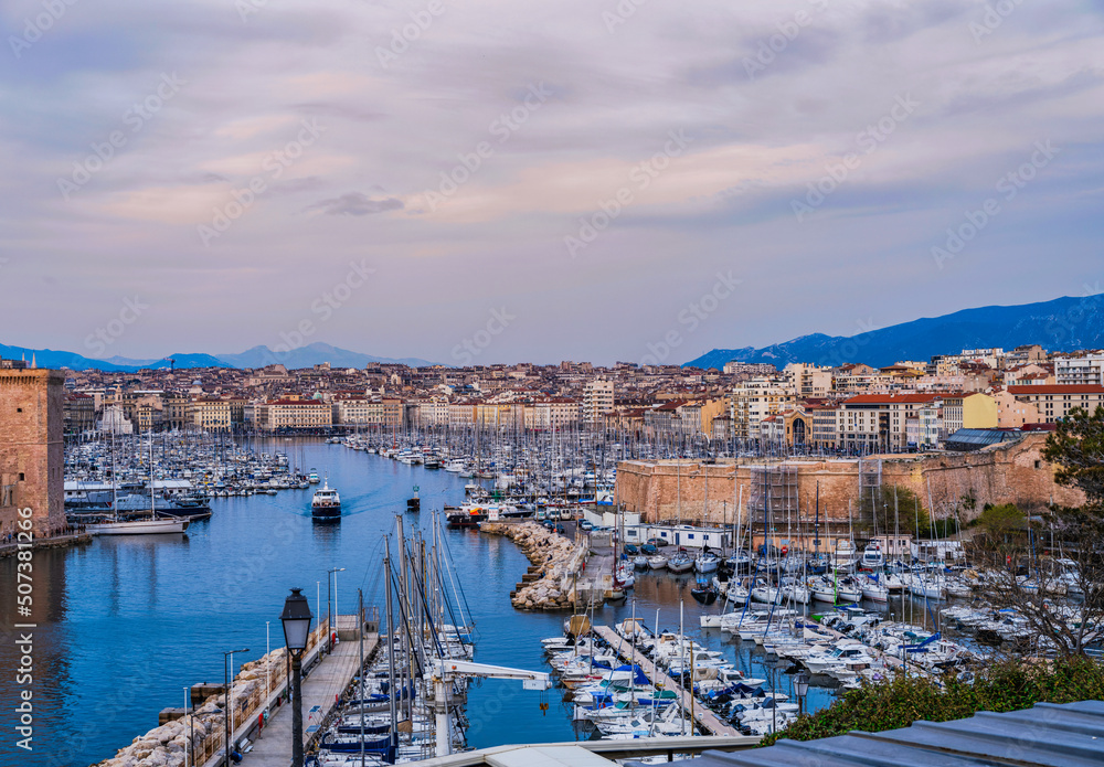 Marseille harbor and city at dusk in Auvergne-Rhone, France