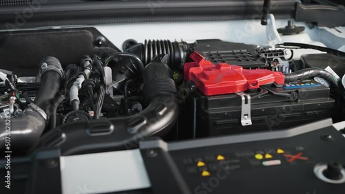 Car engine under the hood of a modern car. New car in the showroom. photo