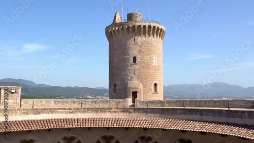Inside view of the Bellver Castle in Palma de Mallorca - Spain. Tilt shot over the Archs on the first floor and the tower.