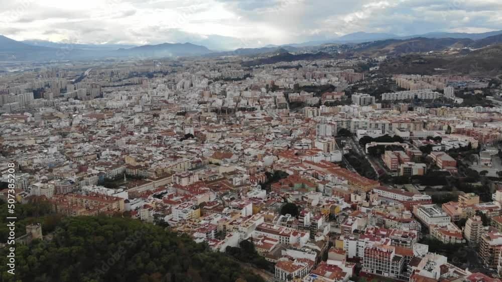 Panoramic Aerial View Of The City Of Malaga, Spain, On A Cloudy Day