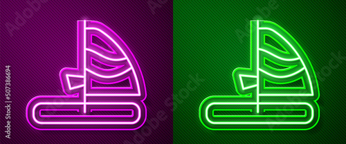 Glowing neon line Windsurfing icon isolated on purple and green background. Vector