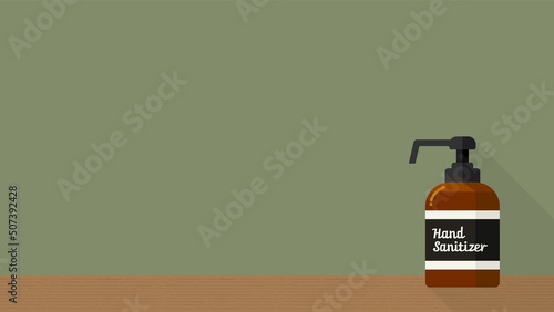 緑色の背景にhand sanitizer の文字が入った手指消毒液の入ったボトル - 感染予防のイメージ素材