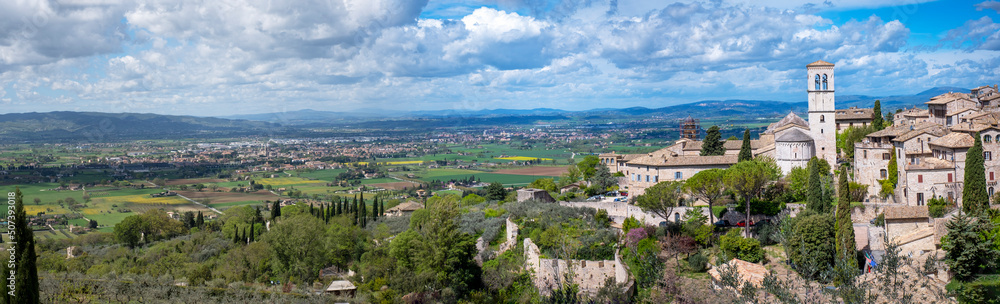 Wide panorama of the ancient houses and countryside surrounding the city of Assisi (Umbria Region, central Italy). Is world famous as birthplace of St. Francis, Italy's christian Patron.