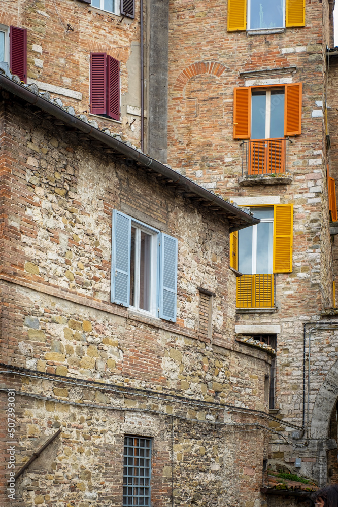Old houses facade, in the old city centre of Perugia. Ancient medieval city, is the capital of Umbria Region (central Italy).