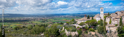 Wide panorama of the ancient houses and countryside surrounding the city of Assisi (Umbria Region, central Italy). Is world famous as birthplace of St. Francis, Italy's christian Patron.