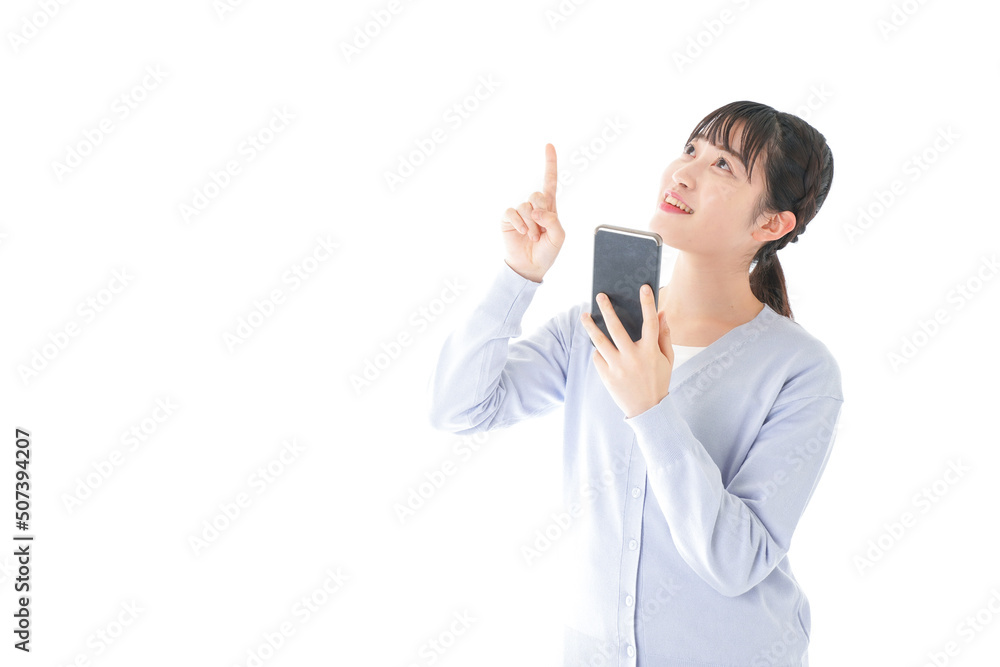 Young woman using IOT appliances with smartphone Young woman using IOT appliances with smartphone