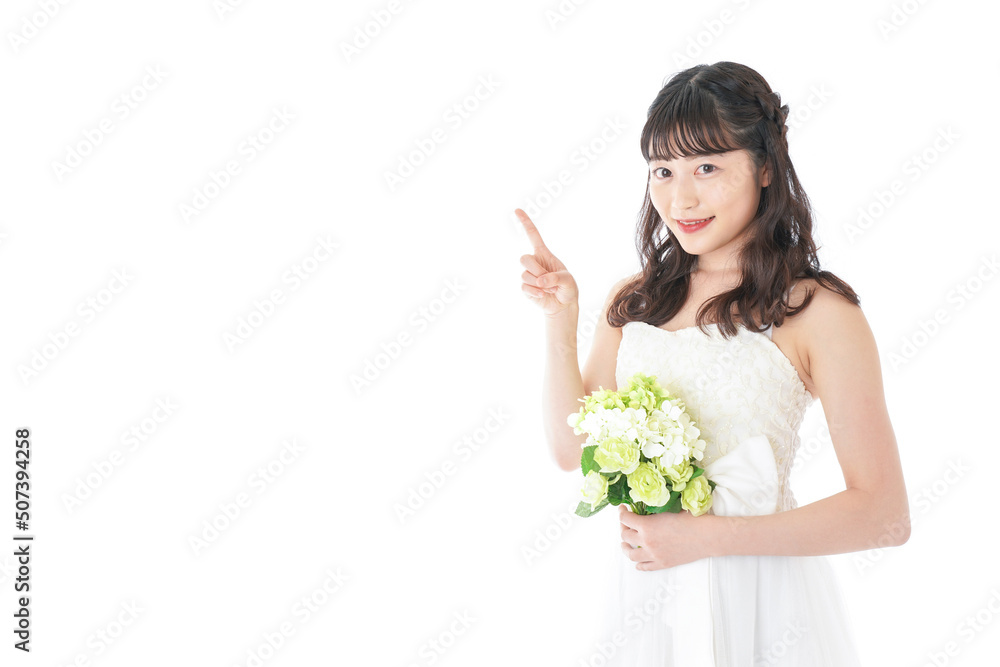 Young woman with bouquet pointing something Young woman with bouquet pointing something